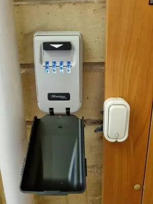 an electronic device on a wall next to a door at Trumpalaike buto nuoma in Rokiškis