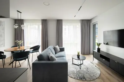 a living room with a couch and a table at No. 2 PARK AVENUE APARTMENT in Kaunas