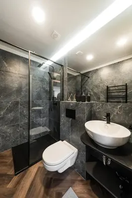 a bathroom with a toilet and a sink and a shower at Riverra House - Panorama View Apartment in Kaunas
