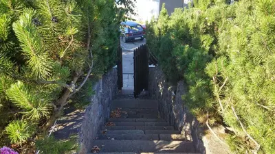 a set of stairs with a car on a road at Prie Galvės in Trakai
