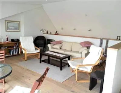 a living room with a couch and chairs and a table at Beautiful Vilnius with a terrace in Vilnius