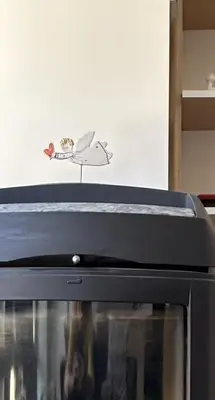 a toy shark sitting on top of a microwave at Beautiful Vilnius with a terrace in Vilnius