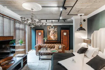 a living room with a couch and a table at Barber Apartment in Kaunas