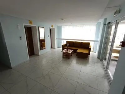 a living room with a couch and a table at viešbutis Jurbarkas in Jurbarkas