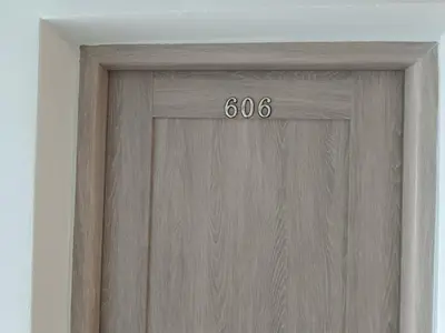 a wooden door with the number on it at viešbutis Jurbarkas in Jurbarkas