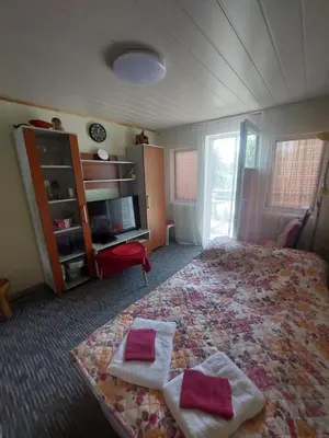 a bedroom with a bed with two towels on it at Dariaus ir Gireno 7 in Zarasai