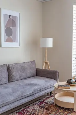 a living room with a couch and a table at Cozy apartment with huge terrace in Vilnius