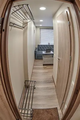 a hallway with a stairway leading to a living room at Great location STUDIO1 on the first floor, 24h self check-in in Kaunas