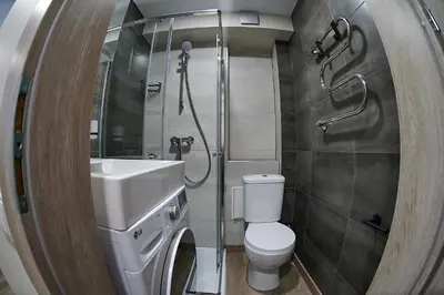 a bathroom with a toilet and a sink and a shower at Great location STUDIO1 on the first floor, 24h self check-in in Kaunas