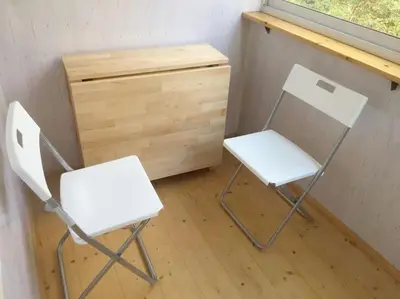 two white chairs sitting next to a wooden dresser at ☆ Perfect Spot Apartment ☆ everywhere in 10 min. in Vilnius