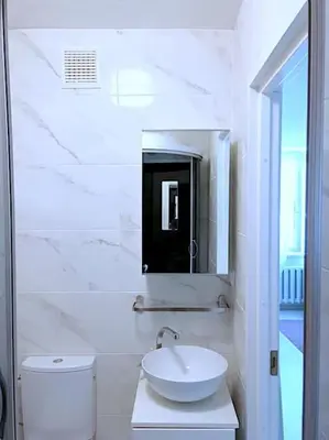a white bathroom with a sink and a toilet at ☆ Perfect Spot Apartment ☆ everywhere in 10 min. in Vilnius