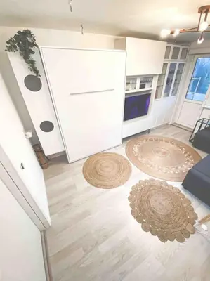 a living room with a couch and a table at Hidden gem apartment In 10min everywhere in Vilnius