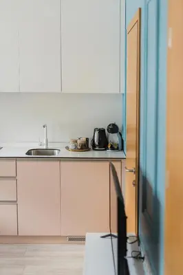 a kitchen with a sink and a counter top at Observation Deck Apartments in Kaunas