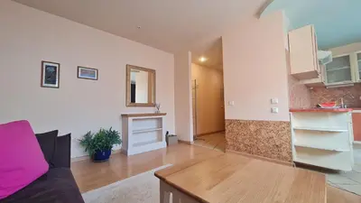a living room with a couch and a table at Rehouse, Vilniaus 45 in Vilnius