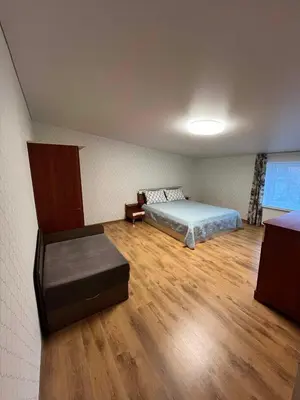 a room with a bed and a couch in it at Svečių namelis in Kaunas