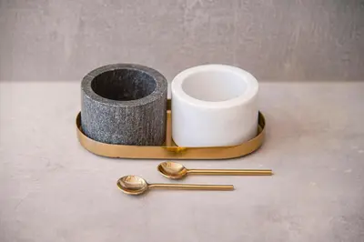 a pair of spoons and a roll of toilet paper at Sigma Skyline Lofts by Reside Baltic in Vilnius
