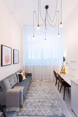 a living room with a couch and a table at Sigma Skyline Lofts by Reside Baltic in Vilnius