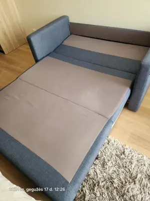 a bed frame in a room with a rug at HaPPy iNN LUX Old Town Studio, Self Check in, Parking in Vilnius