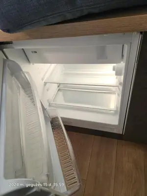 an empty refrigerator with its door open in a kitchen at HaPPy iNN LUX Old Town Studio, Self Check in, Parking in Vilnius