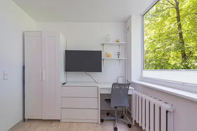 a home office with a computer desk and a window at Partizanų studio apartment #1 by Polo Apartments in Kaunas