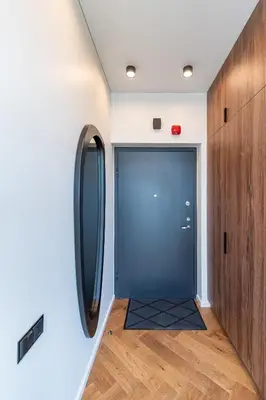 a hallway with a blue door in a room at Panoramic View 1 BD Apartment by Domvia in Kaunas