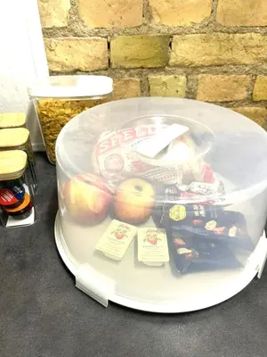 a plastic container filled with apples and other food at Green Bridge Studio in Vilnius