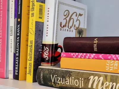 a group of books sitting on a shelf at Butas šalia parko in Radviliškis