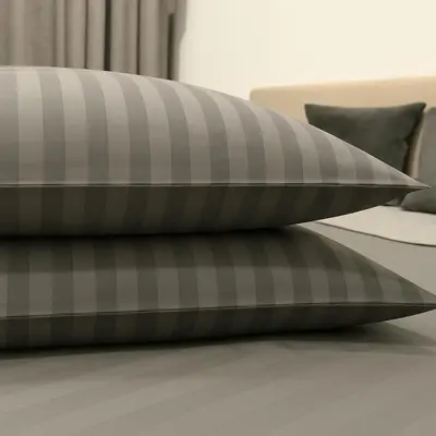 a pair of pillows on a bed at Butas šalia parko in Radviliškis