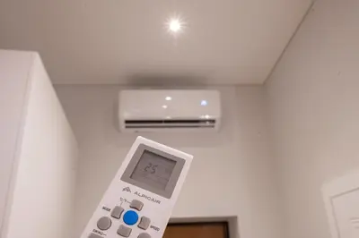 a remote control in a room with a air conditioner at Art Boutique I Old Town Apartments w-AC I cohost in Vilnius
