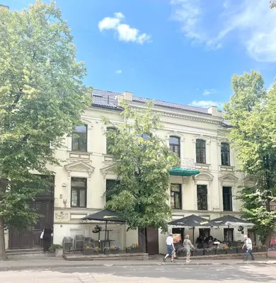 a white building with people walking in front of it at Art Boutique I Old Town Apartments w-AC I cohost in Vilnius