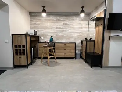 a kitchen with a counter and a chair in a room at Gabriel in Šveicarija