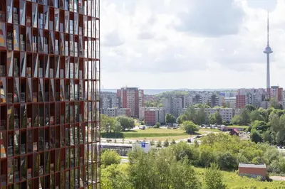 a tall building with a view of a city at VIXI Skylum in Vilnius