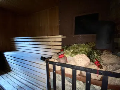 a tub filled with rocks and vegetables in a room at Malinada-kaimo sodyba in Šalčininkai