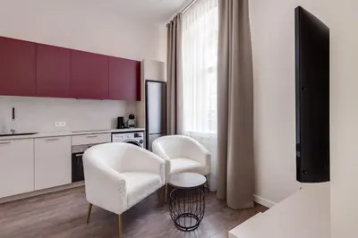 a kitchen with two chairs and a table in it at StudioApart23 in Vilnius