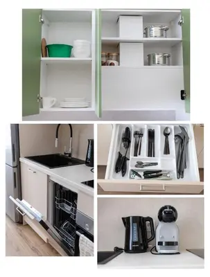 a kitchen with white cabinets and a sink at StudioApart23 in Vilnius