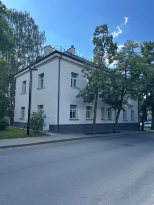 a white building on the side of a street at Cozy BOHO room in Trakai Old town in Trakai