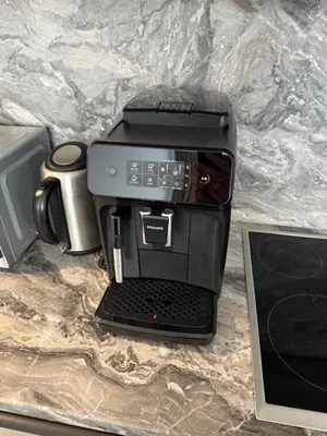 a coffee maker sitting on top of a counter at Aušros Alėjos Apartamentai in Šiauliai