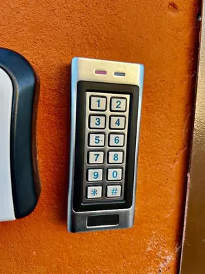 a remote control sitting on top of a table at Gedimino 19 apartments in the old town of Ukmergė in Ukmergė