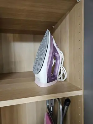 a computer mouse sitting on top of a wooden shelf at Trakai City apartment 2-bedroom in Šiauliai