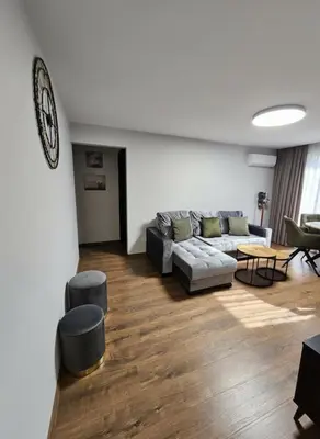 a living room with a couch and a table at Trakai City apartment 2-bedroom in Šiauliai