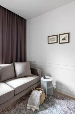 a living room with a couch and a table at Feels like home - Jauku kaip namuose in Kaunas