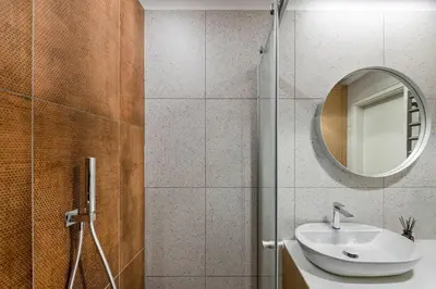 a bathroom with a sink and a mirror at Feels like home - Jauku kaip namuose in Kaunas