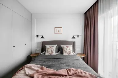 a bedroom with a bed with two pillows at Feels like home - Jauku kaip namuose in Kaunas