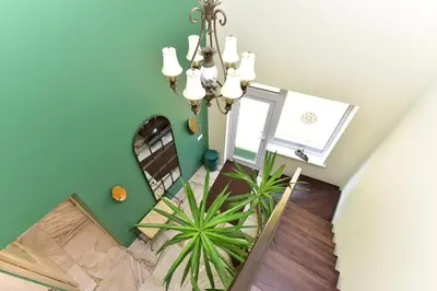an overhead view of a dining room with a chandelier at Green Harmony in Antalgė