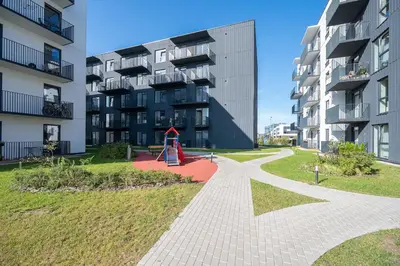 a playground in front of a apartment building at Scandinavian style apartment in Vilnius