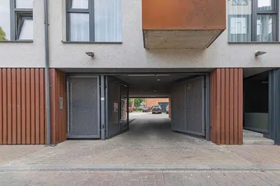 a hallway of a building with open doors at Boutique Studio with Free Parking & AC in Kaunas