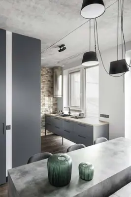 a kitchen with a table and chairs and a sink at Boutique Studio with Free Parking & AC in Kaunas