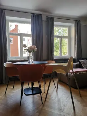 a living room with a table and chairs and a couch at Saviciaus in Vilnius