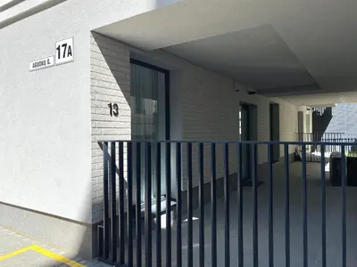 a building with a gate in front of a building at White Lotus Apartment 13 by Reside Baltic in Vilnius