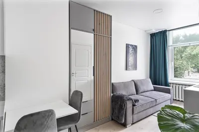a living room with a couch and a table at Central Cozy 1Bedroom Apartment with Sofa Bed - Sleeps 4 in Vilnius